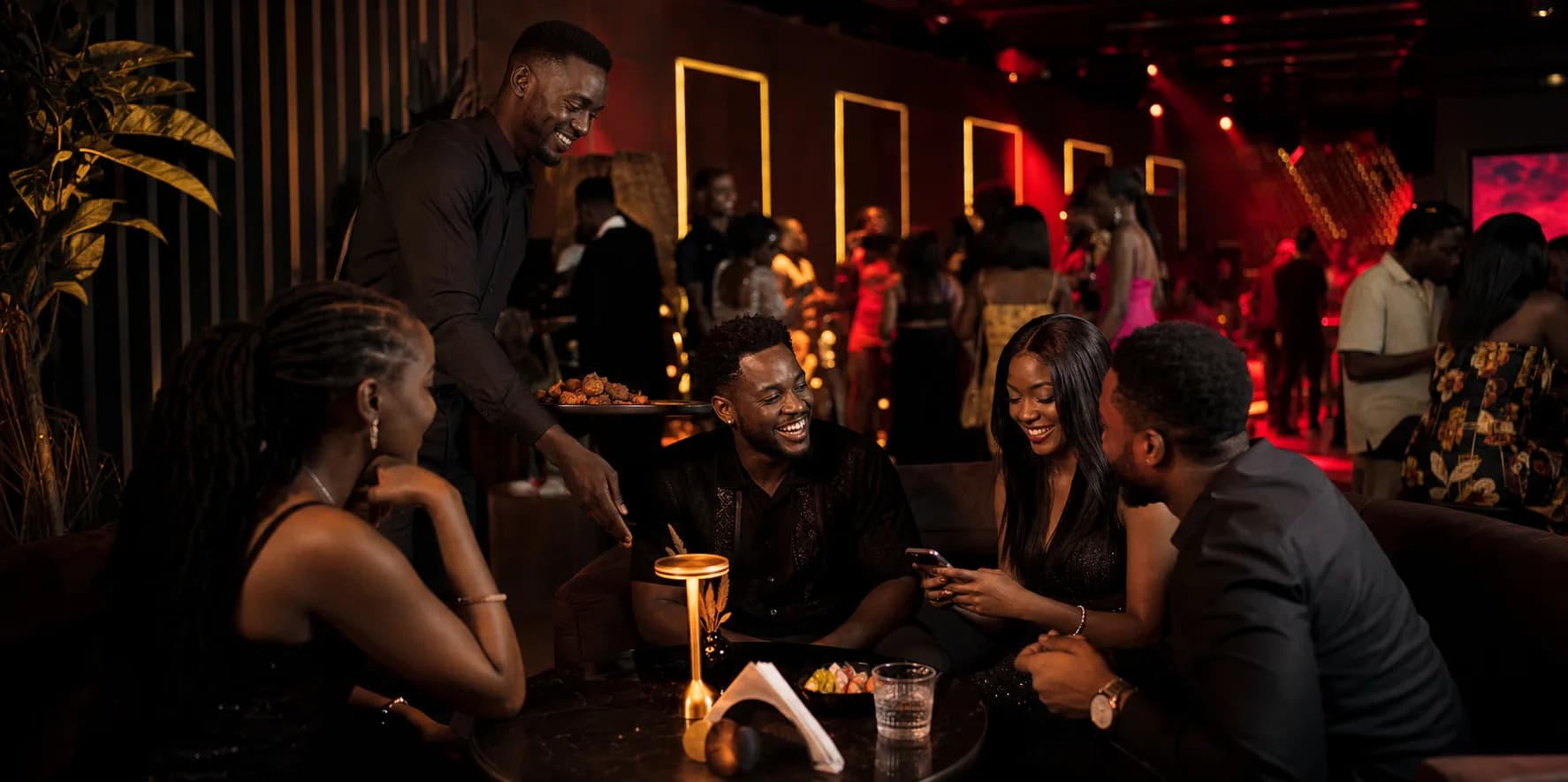 Friends sharing a premium night out while table service continues